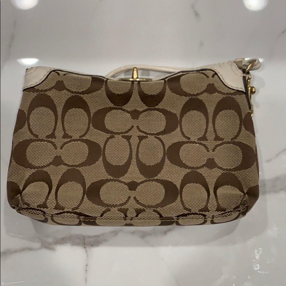 Coach signature wristlet.
